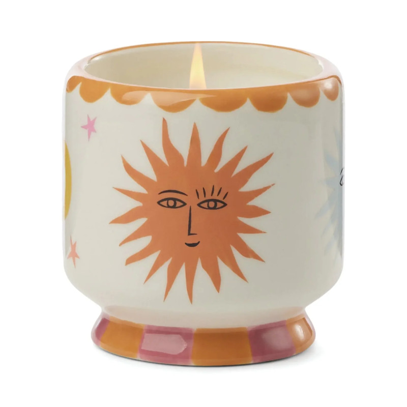 Bougie parfumée Orange Blossom A Dopo Paddywax avec décor soleil coloré en céramique.