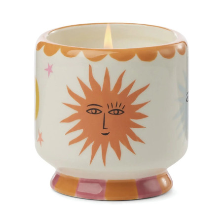 Bougie parfumée Orange Blossom A Dopo Paddywax avec décor soleil coloré en céramique.