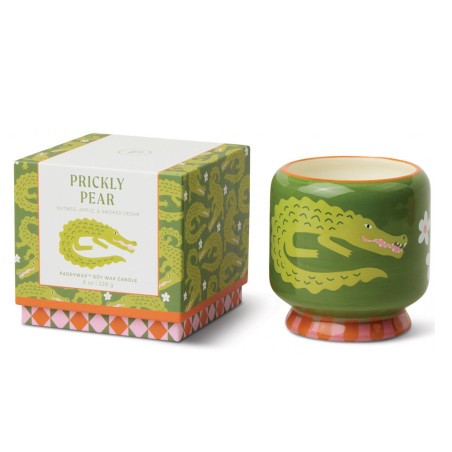 Bougie A Dopo Prickly Pear Paddywax avec motif crocodile et pot en céramique colorée.